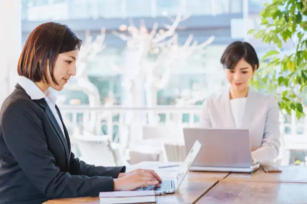 Two women who do desk work