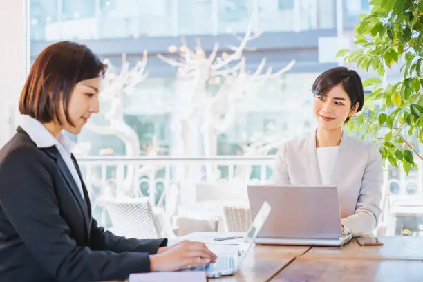 Two women who do desk work