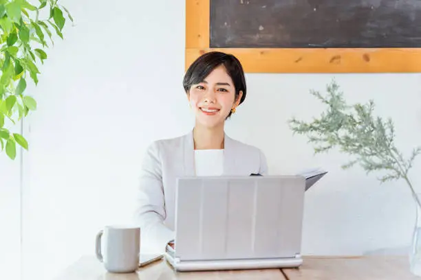 The image of a working woman (wearing a suit / jacket)