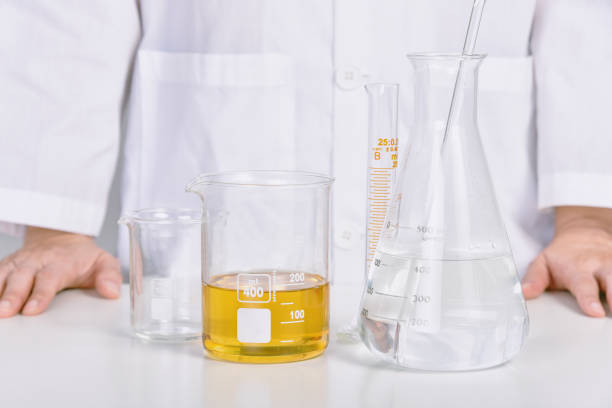 istock Scientist with oil beaker, Laboratory and science experiments, Formulating the chemical for medical research, Quality control of petroleum industry products concept. 1405519888