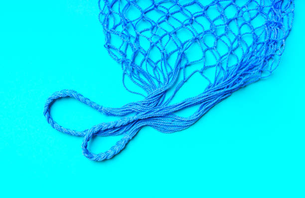 istock Eco-friendly reusable mesh bag on a blue background. 1405519907