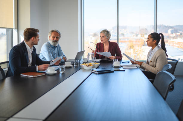 istock Small Diverse Group Making Financial Decisions at a Meeting 1405521837