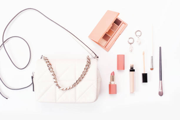 istock Female bag and cosmetics on white background top view. 1405521853