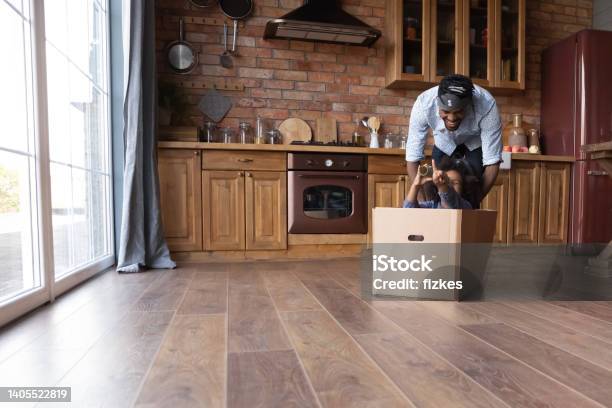 Cheerful African Family Having Fun In Kitchen Stock Photo - Download Image Now - Foster Care, Males, Box - Container