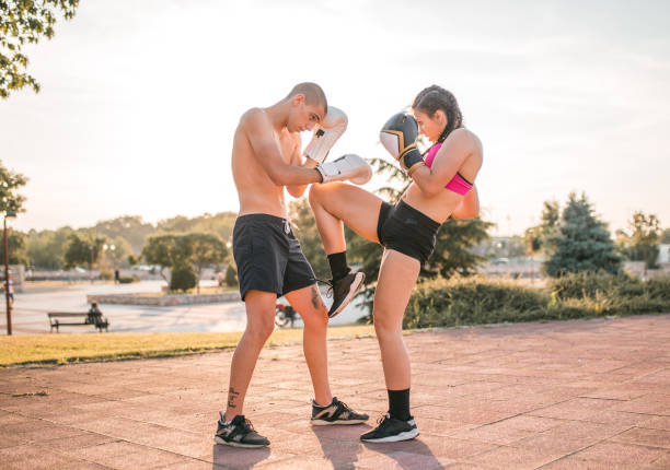 istock Two athletes are training kickboxing in the park 1405523929