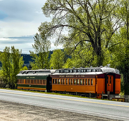 Vintage railroad cars for display and representation of the trains the Norther Pacific lack of railway extension that would have no assured Virginia City a different future.  The city used to have a substantial population of Chinese people.