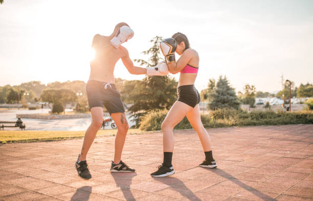 istock Two fighters training boxing in the park 1405527757