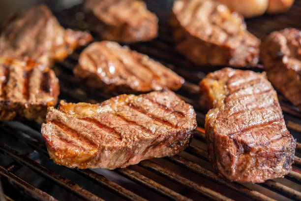 Picanha barbecue roasted over hot coals. This form of churrasco is widely consumed throughout Brazil. stock photo