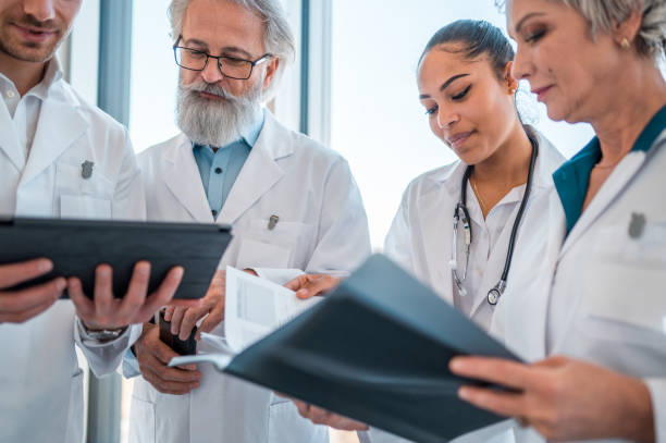 istock Senior Surgeons Sharing Laboratory Results to Staff 1405531187