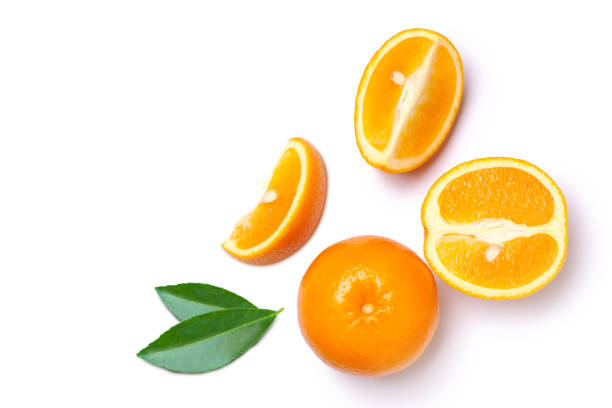 istock Orange fruit with cut sliced and green leaves isolated on white 1405531395