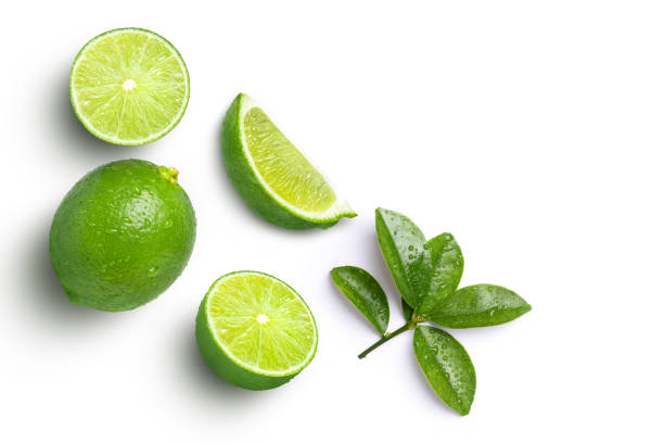 istock Lime fruits with green leaf and cut in half slice isolated on white background 1405532130