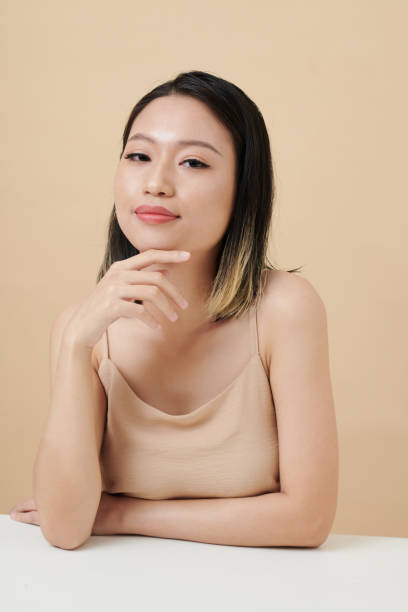istock Young Woman Touching Face 1405533151
