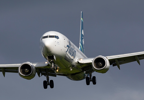 Portland, Oregon, USA - May 6, 2022: An Alaska Airlines Boeing 737 comes in for a landing at Portland International Airport.
