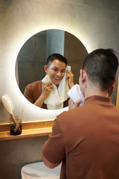 istock Man Wiping Face with Towel 1405534019