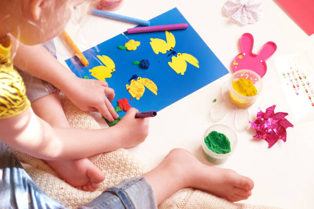 istock DIY Easter home decor from paper and plasticine, Gift ideas, painting Easter card. Handmade.  Childrens Easter crafts. 1405534580