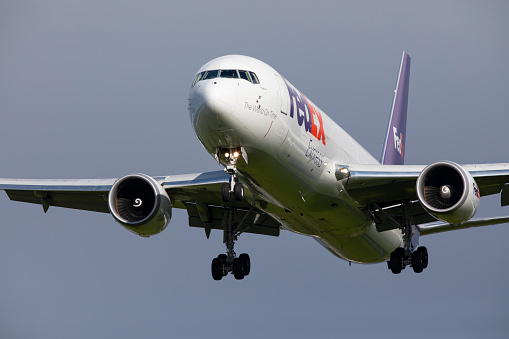 Portland, Oregon, USA - April 30, 2022: A FedEx Express Boeing 767 coming in for landing at Portland International Airport.