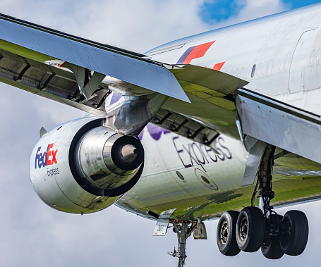 Portland, Oregon, USA - April 8th 2022: A close up view of a FedEx Express McDonnell Douglas MD-11 as it comes in for landing at Portland International Airport.