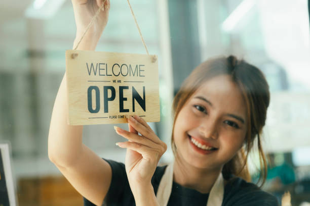 istock Young business owner open the coffee shop. 1405537088