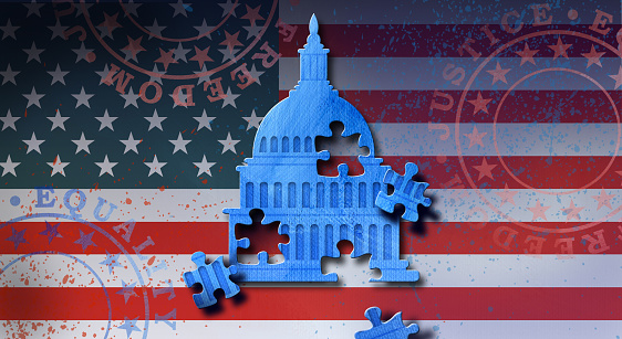 Conceptual graphic illustration of stylized American Senate dome with puzzle pieces coming loose. Art represents a nation’s struggle to stay united through new and complicated challenges of the times. For political and social themes.