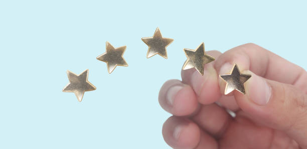 istock Rise on increasing five stars in human hand 1405537787