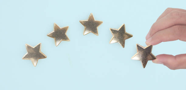istock Rise on increasing five stars in human hand 1405537791