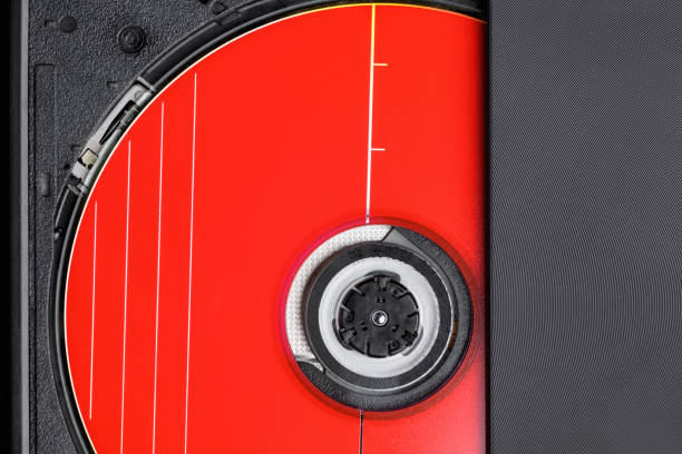 istock DVD rom drive, CD-ROM drive with open tray. Red CD disk and floppy drive close-up, top view 1405537990