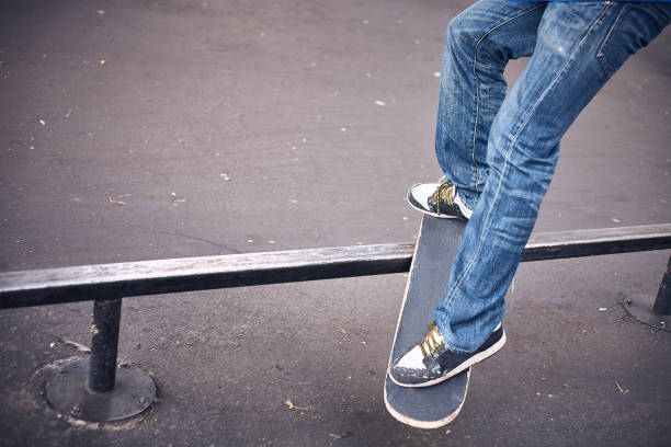 istock Person skateboarding on railing 1405538336