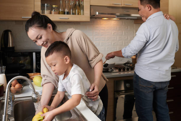 istock Family Cooking Dinner 1405538378