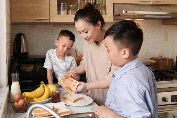 istock Family Making Breakfast Toasts 1405538398
