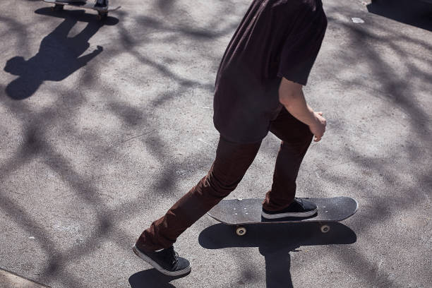 istock Low section of two skateboarders 1405539073