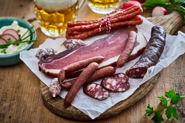 istock Smoked lard and sausages on cutting board 1405540276
