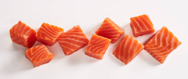 istock Fresh sliced salmon fillet on white table 1405540549