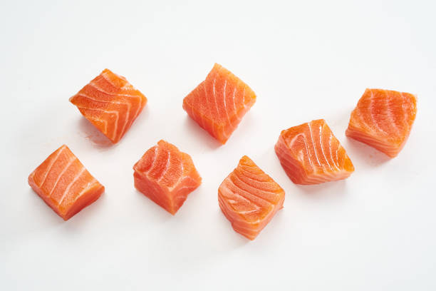 Slices of salmon fillet on table
