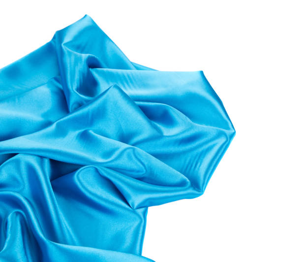 istock Soft folds of deep blue silk cloth texture. 1405542239