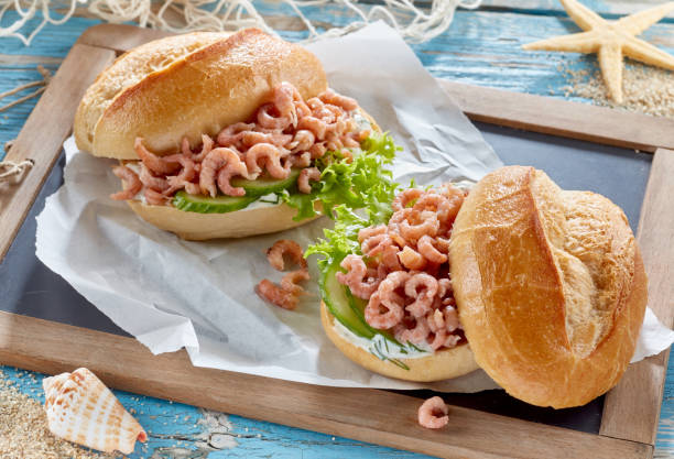istock Appetizing sandwiches with shrimps on tray 1405542461