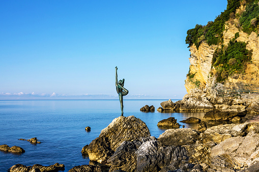 Budva, Montenegro - June 27, 2022: gymnast statue on seaside of Budva