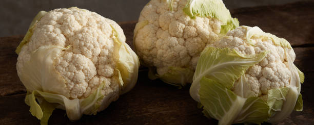 istock Fresh cauliflower on wooden table 1405543849