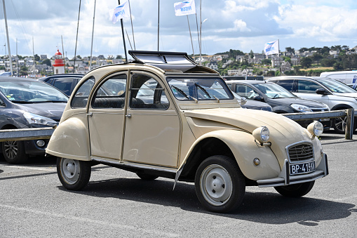 Erquy, France - June 26, 2022: An old being old timer classic Citroen 2CV (Dodoche ) car in a very good shape. The Citroën 2CV (French deux chevaux \