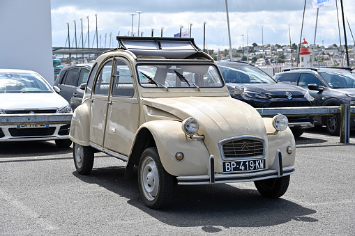 Erquy, France - June 26, 2022: An old being old timer classic Citroen 2CV (Dodoche ) car in a very good shape. The Citroën 2CV (French deux chevaux \