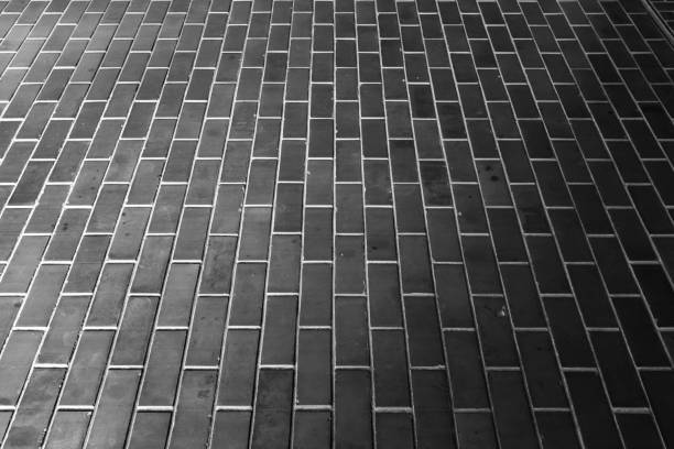 istock The sun shines on the ground paved with bricks, the brick wall 1405551692