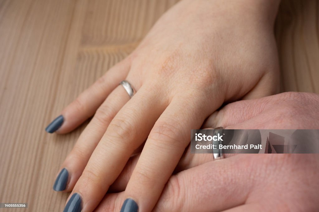 Hände mit Eheringen Hands with wedding rings, after a wedding Adult Stock Photo