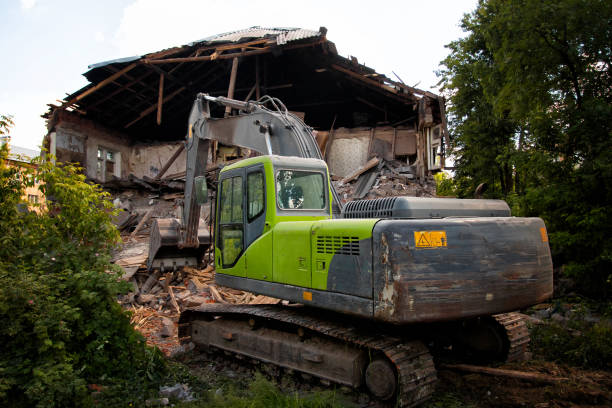 istock Powerful crawler excavator demolishes an old building 1405556616