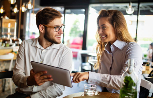 istock Two young colleagues chatting together on a break 1405558496