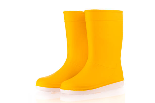 istock Yellow rubber boots isolated on white background. Kids shoes. 1405559816