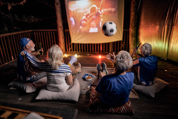 istock Watching a successful soccer match on patio by night! 1405560249
