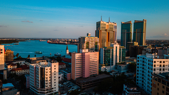 Dar es Salaam - Tanzania - June 16 2022 - Cityscape of Dar es Salaam at sunset featuring residential and office buildings.