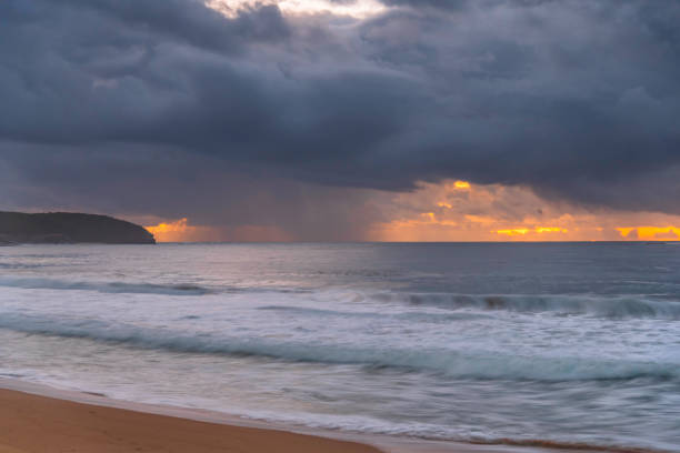 istock Dawn seascape with rain clouds 1405561695