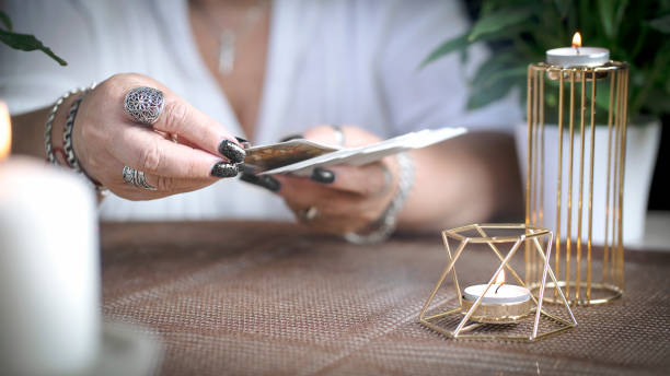 Defocused still Life with tarot cards. Divination concept, magic or fortune telling rite with occult and esoteric symbols.