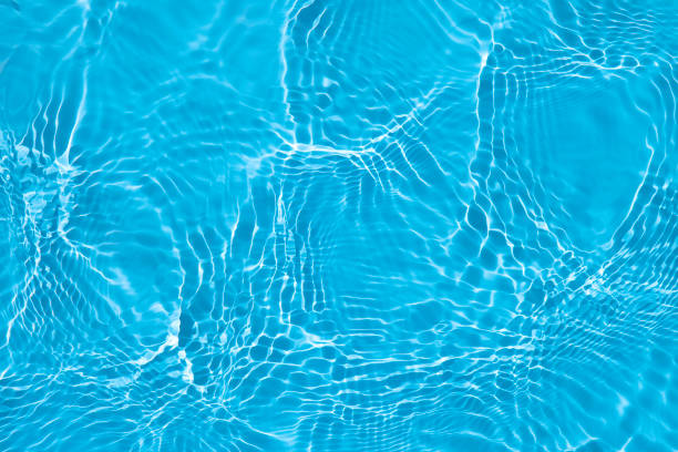 Blue wave abstract or rippled water texture background stock photo
