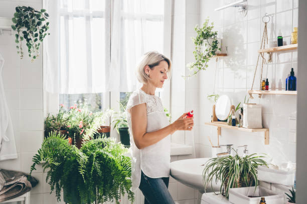 istock Woman staying in eco friendly white bathroom 1405566760